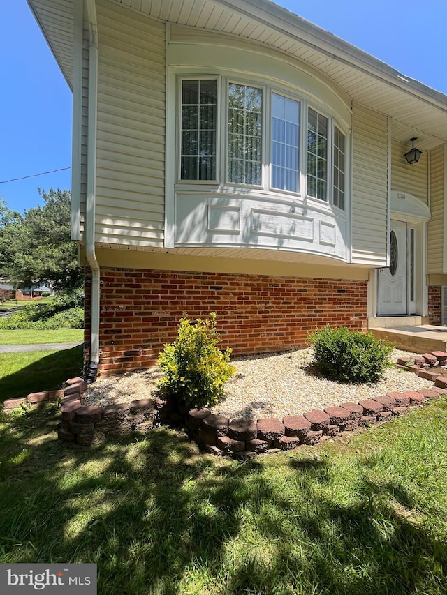 7001 Kepner Ct, Lanham, MD 20706 - view of side of home with brick siding and a lawn
