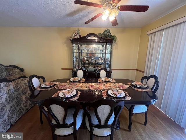 7001 Kepner Ct, Lanham, MD 20706 - dining area with wood finished floors, a textured ceiling, and a ceiling fan