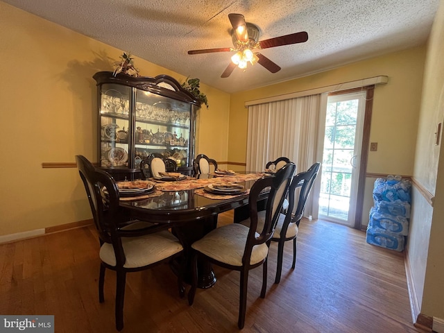 7001 Kepner Ct, Lanham, MD 20706 - dining room featuring a ceiling fan, wood finished floors, a textured ceiling, and baseboards