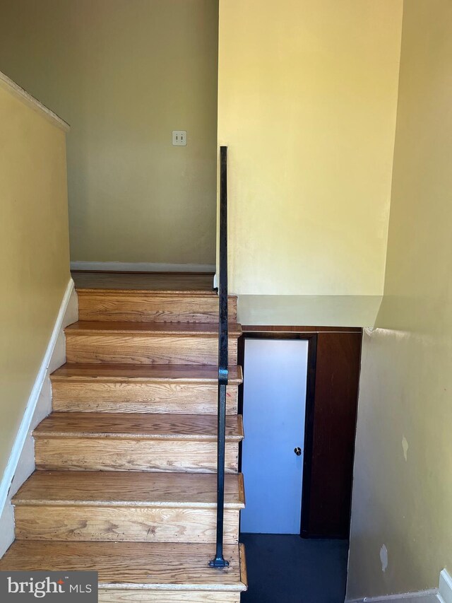 7001 Kepner Ct, Lanham, MD 20706 - staircase featuring wood finished floors