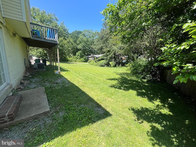 7001 Kepner Ct, Lanham, MD 20706 - view of green lawn featuring a balcony and central AC unit