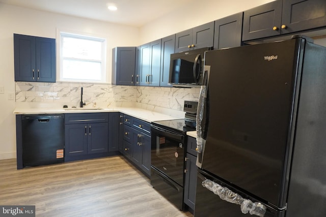 482-484 Brunswick St, Baltimore, MD 21223 - kitchen with black appliances, a sink, tasteful backsplash, light countertops, and recessed lighting