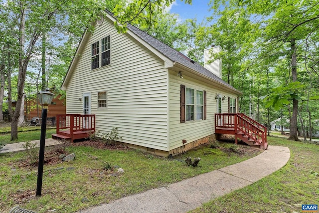 13 Tobacco Ter, Palmyra, VA 22963 - view of property exterior with a chimney, a lawn, and roof with shingles
