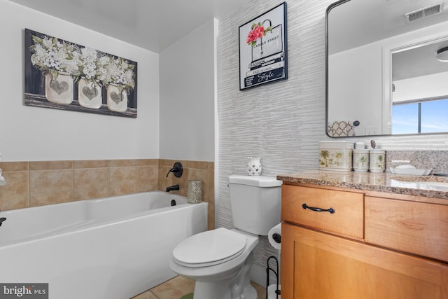 414 Water St Unit 1112, Baltimore, MD 21202 - bathroom featuring toilet, a garden tub, vanity, and tile patterned flooring