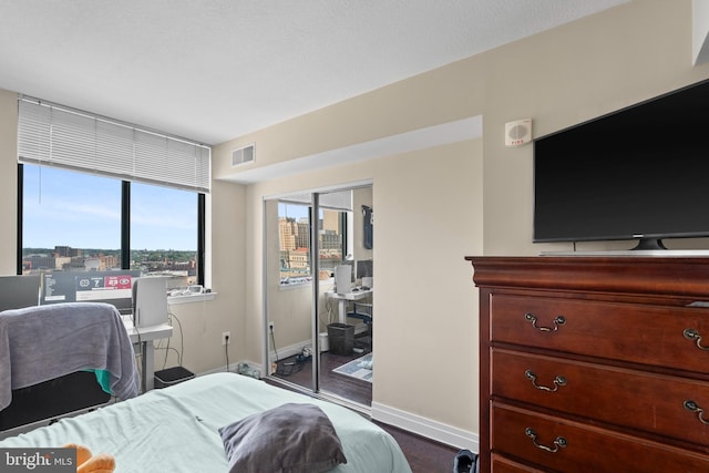 414 Water St Unit 1112, Baltimore, MD 21202 - bedroom featuring baseboards and a closet