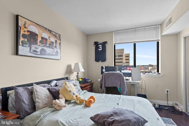 414 Water St Unit 1112, Baltimore, MD 21202 - bedroom featuring baseboards and wood finished floors