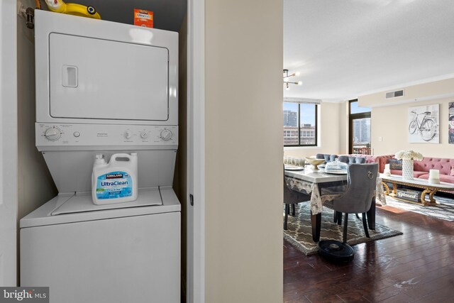 414 Water St Unit 1112, Baltimore, MD 21202 - laundry area with estacked washer and dryer and hardwood / wood-style floors