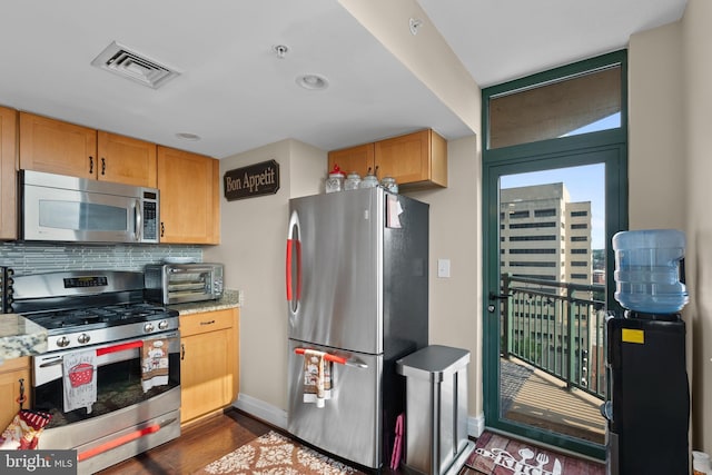 414 Water St Unit 1112, Baltimore, MD 21202 - kitchen with appliances with stainless steel finishes, dark wood-type flooring, baseboards, backsplash, and recessed lighting