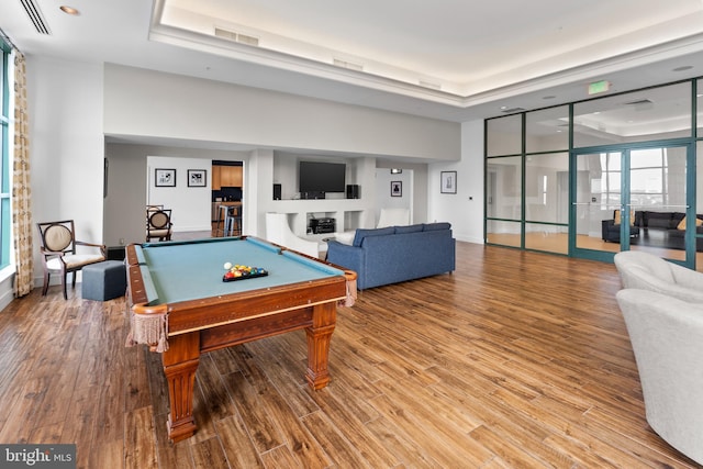 414 Water St Unit 1112, Baltimore, MD 21202 - rec room featuring a tray ceiling, billiards, wood finished floors, baseboards, and recessed lighting
