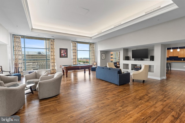 414 Water St Unit 1112, Baltimore, MD 21202 - living room with a tray ceiling, pool table, wood finished floors, expansive windows, and baseboards