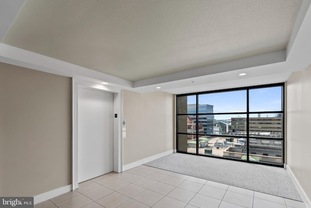 414 Water St Unit 1112, Baltimore, MD 21202 - unfurnished room with light colored carpet, baseboards, elevator, a textured ceiling, and recessed lighting