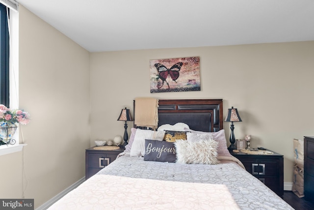 414 Water St Unit 1112, Baltimore, MD 21202 - bedroom with wood finished floors and baseboards