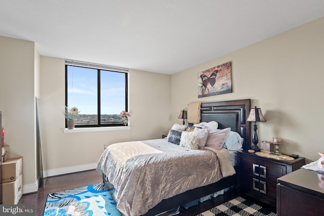 414 Water St Unit 1112, Baltimore, MD 21202 - bedroom featuring baseboards and wood finished floors