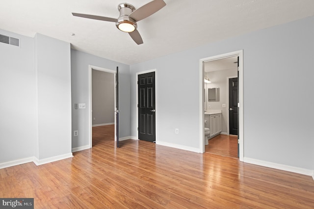 2000 Phillips Ter Unit 12, Annapolis, MD 21401 - unfurnished bedroom with light wood-style floors, baseboards, connected bathroom, and a ceiling fan