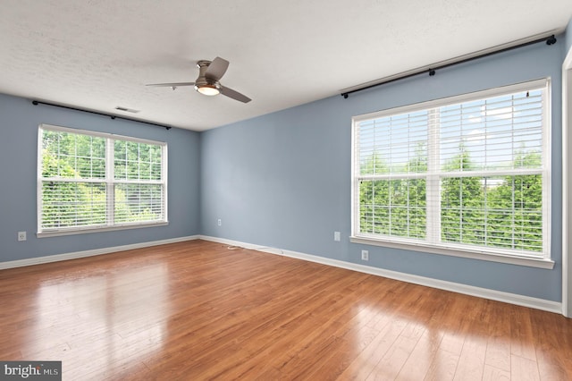 2000 Phillips Ter Unit 12, Annapolis, MD 21401 - unfurnished room featuring hardwood / wood-style flooring, ceiling fan, baseboards, and a textured ceiling
