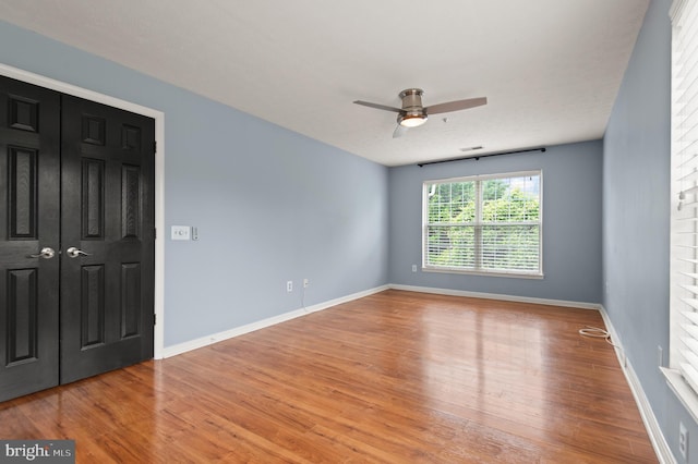 2000 Phillips Ter Unit 12, Annapolis, MD 21401 - unfurnished bedroom with wood finished floors, baseboards, and a ceiling fan