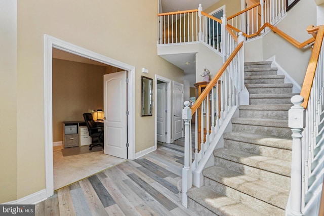148 Ryans Run, Sicklerville, NJ 08081 - staircase featuring wood finished floors and a towering ceiling