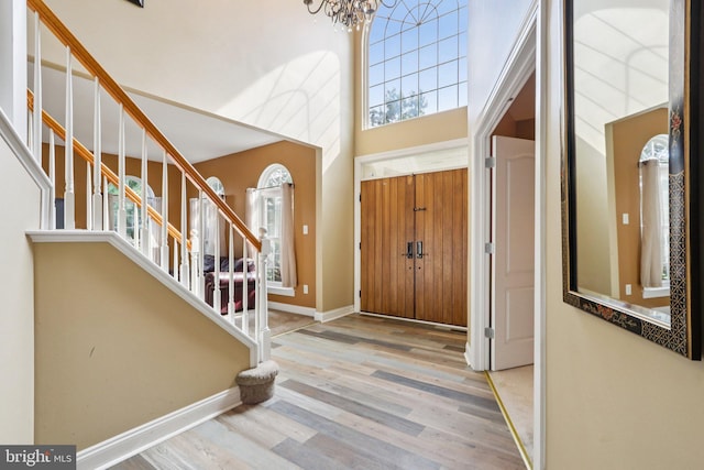 148 Ryans Run, Sicklerville, NJ 08081 - foyer entrance with wood finished floors, stairs, a high ceiling, and a chandelier