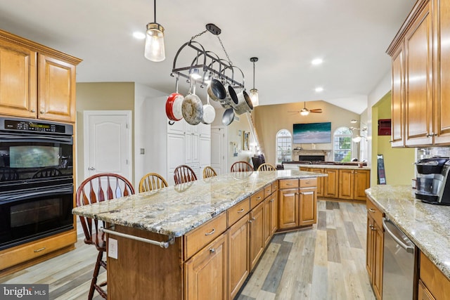148 Ryans Run, Sicklerville, NJ 08081 - kitchen featuring ceiling fan, stainless steel dishwasher, a kitchen breakfast bar, a fireplace, and light wood-style flooring