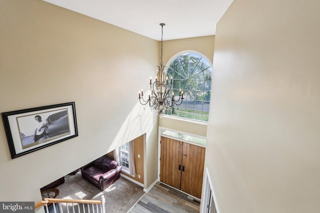 148 Ryans Run, Sicklerville, NJ 08081 - entrance foyer with a chandelier, wood finished floors, and a towering ceiling