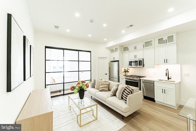 2517 Ontario Rd NW Unit 5, Washington, DC 20009 - living area with light wood finished floors and recessed lighting