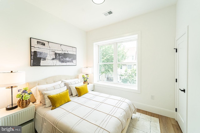 2517 Ontario Rd NW Unit 5, Washington, DC 20009 - bedroom featuring wood finished floors and baseboards