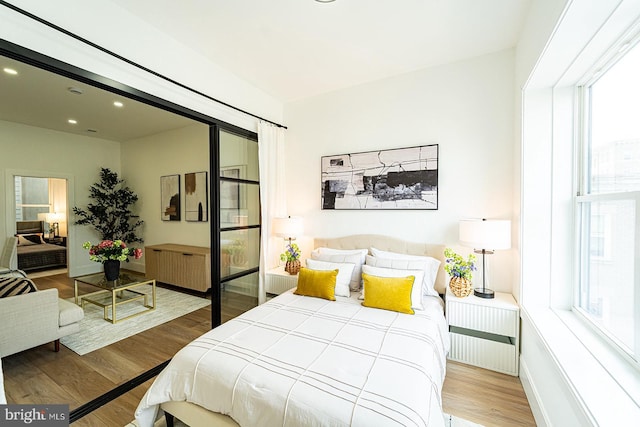 2517 Ontario Rd NW Unit 5, Washington, DC 20009 - bedroom with multiple windows, wood finished floors, and recessed lighting