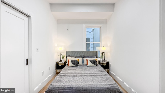 2517 Ontario Rd NW Unit 5, Washington, DC 20009 - bedroom with baseboards and wood finished floors