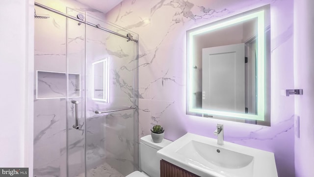 2517 Ontario Rd NW Unit 5, Washington, DC 20009 - bathroom with vanity, a marble finish shower, and toilet
