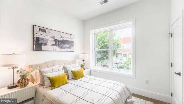 2517 Ontario Rd NW Unit 5, Washington, DC 20009 - bedroom with baseboards and wood finished floors