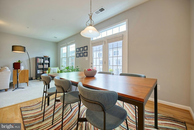 21623 Romans Dr, Ashburn, VA 20147 - dining area with baseboards and wood finished floors