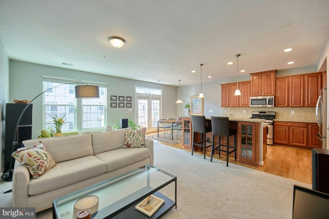 21623 Romans Dr, Ashburn, VA 20147 - living room with recessed lighting and light wood-style floors