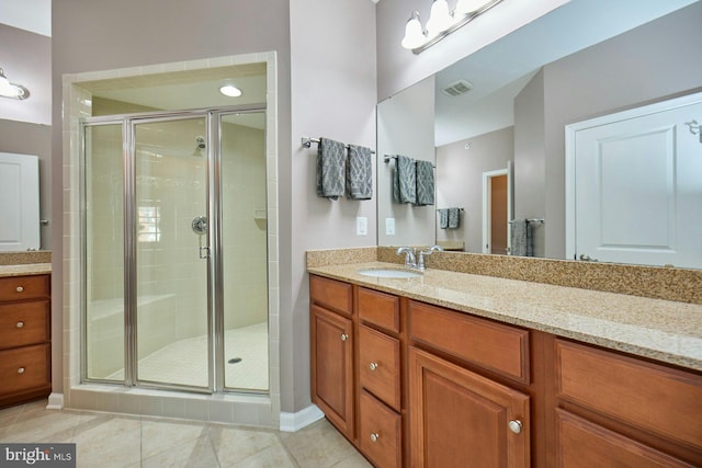 21623 Romans Dr, Ashburn, VA 20147 - full bath featuring vanity, a shower stall, tile patterned floors, and baseboards
