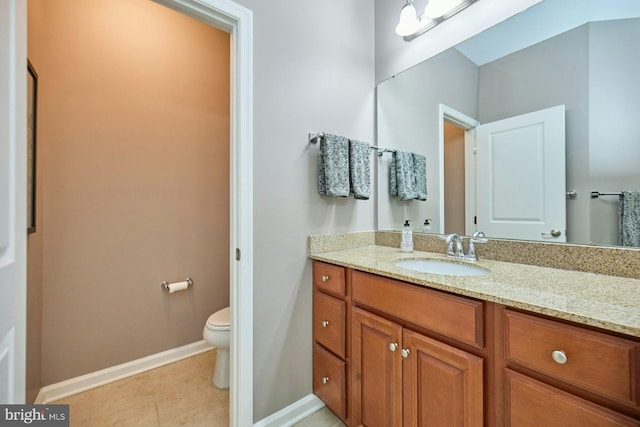 21623 Romans Dr, Ashburn, VA 20147 - bathroom featuring vanity, toilet, baseboards, and tile patterned floors