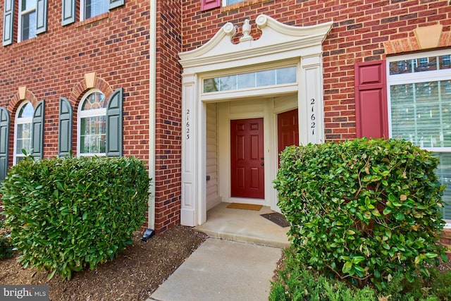 21623 Romans Dr, Ashburn, VA 20147 - doorway to property featuring brick siding