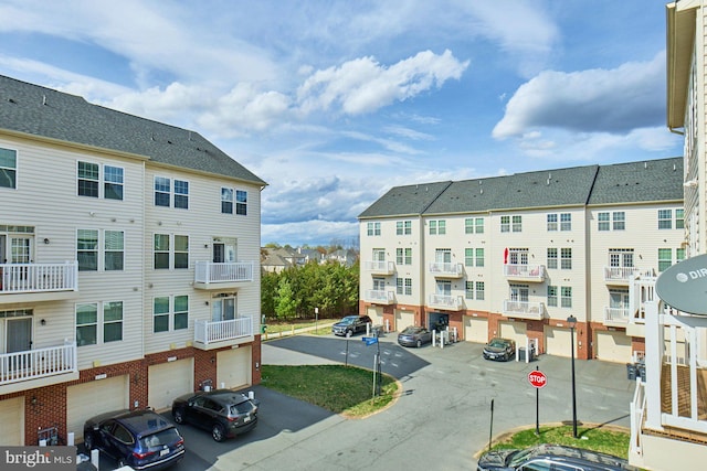 21623 Romans Dr, Ashburn, VA 20147 - view of building exterior with an attached garage and a residential view