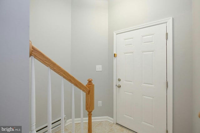 21623 Romans Dr, Ashburn, VA 20147 - foyer featuring baseboards, light tile patterned floors, and a baseboard radiator