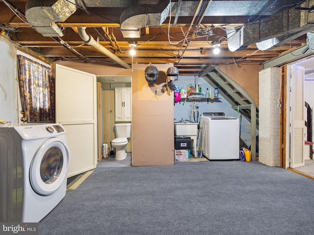 1016 Elm Rd, Halethorpe, MD 21227 - unfinished below grade area with washer / dryer and carpet flooring