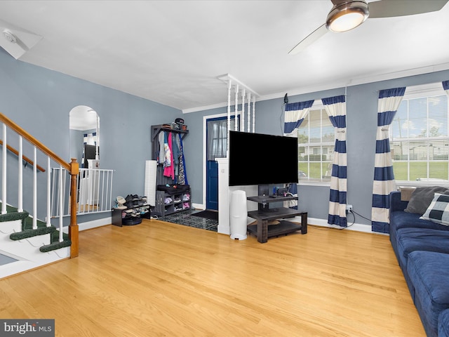 1016 Elm Rd, Halethorpe, MD 21227 - living room with wood finished floors, a ceiling fan, arched walkways, and baseboards