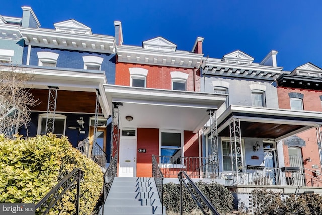 3115 Warder St NW, Washington, DC 20010 - townhome / multi-family property featuring a porch, brick siding, and stairway