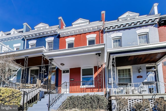 3115 Warder St NW, Washington, DC 20010 - townhome / multi-family property featuring covered porch and brick siding