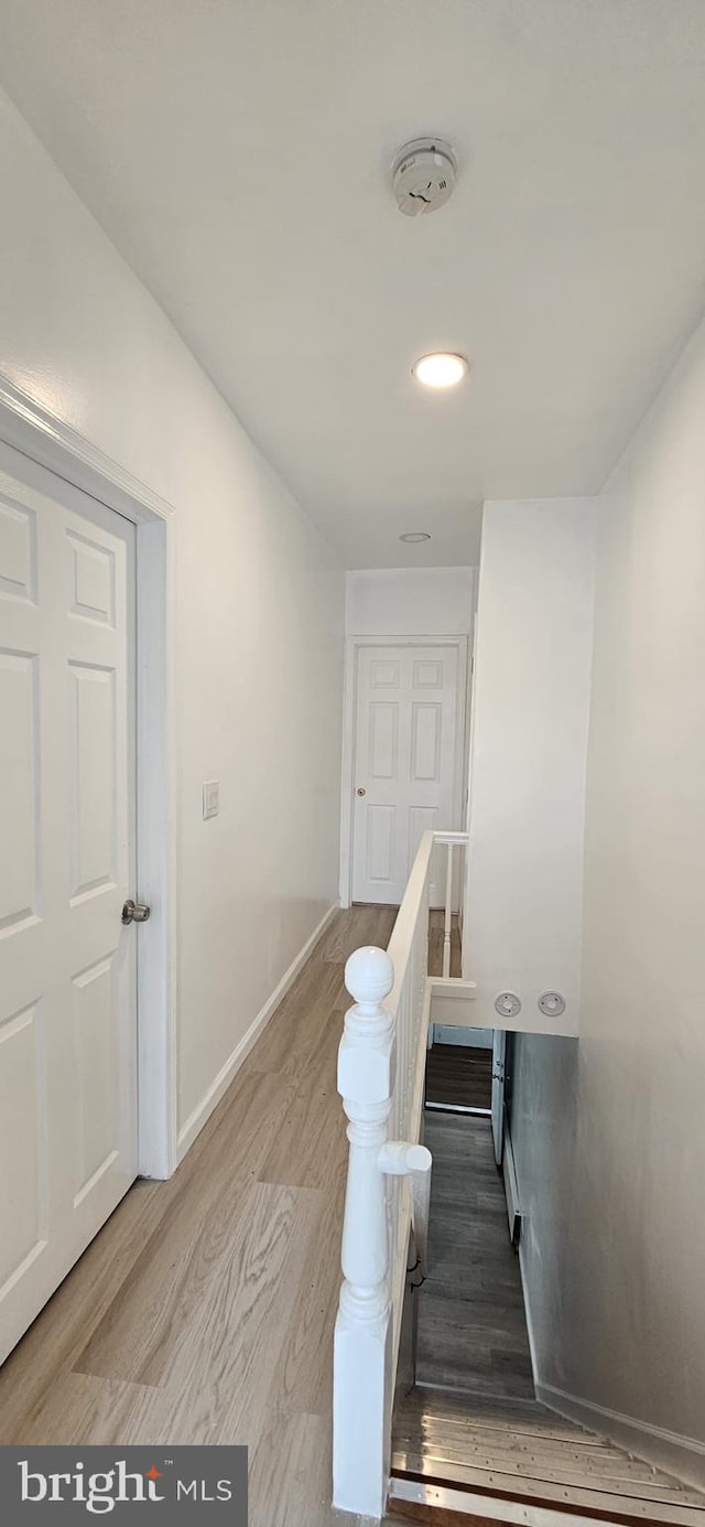 2540 W Silver St, Philadelphia, PA 19132 - stairs featuring wood finished floors, baseboards, and recessed lighting