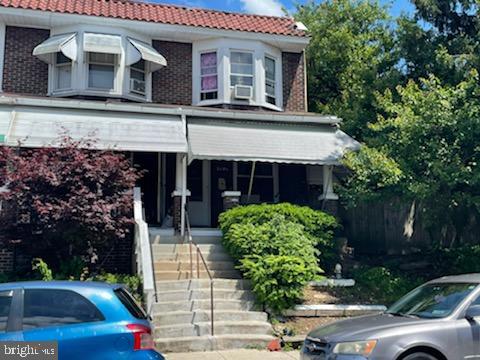 319 Linden St, Reading, PA 19604 - view of front of home with a tiled roof and stairway