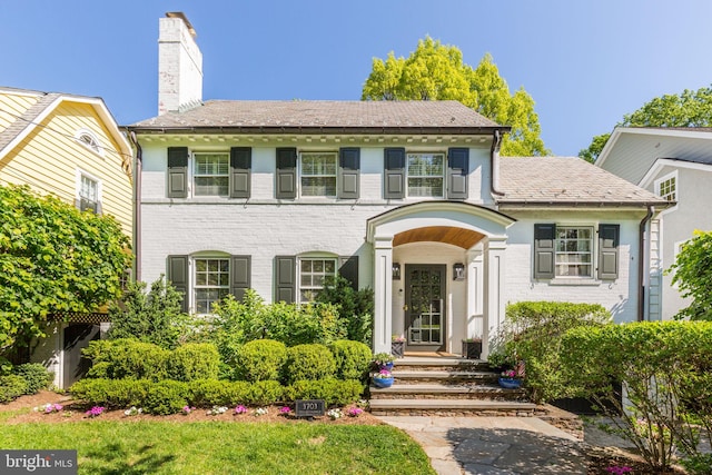 3703 Thornapple St, Chevy Chase, MD 20815 - colonial home featuring a chimney and brick siding