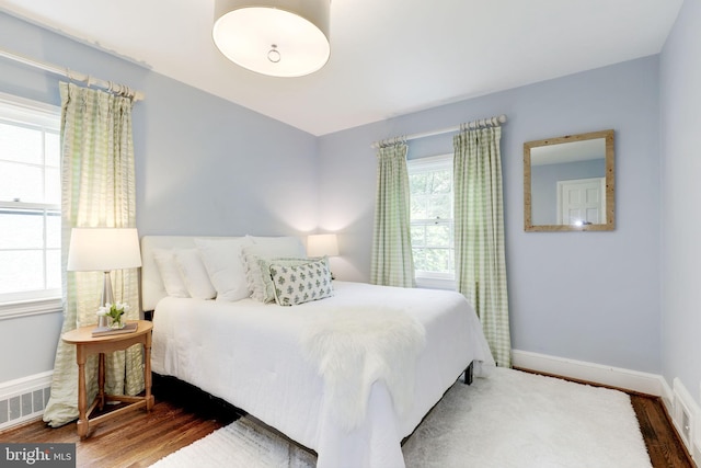 3703 Thornapple St, Chevy Chase, MD 20815 - bedroom featuring wood finished floors and baseboards