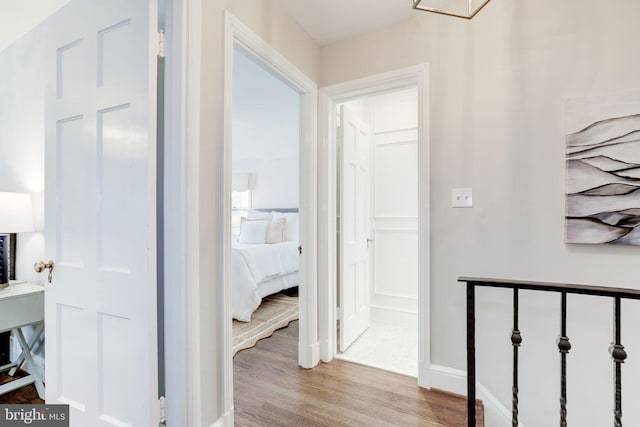 3703 Thornapple St, Chevy Chase, MD 20815 - corridor featuring wood finished floors and baseboards