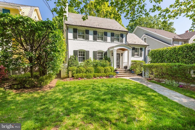 3703 Thornapple St, Chevy Chase, MD 20815 - view of front facade with a front yard and brick siding