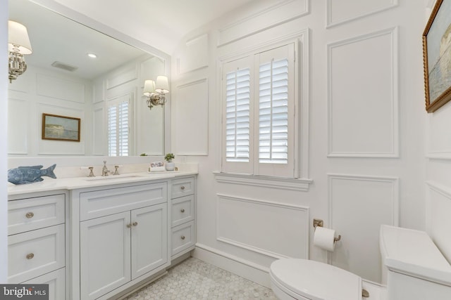 3703 Thornapple St, Chevy Chase, MD 20815 - bathroom with toilet, vanity, plenty of natural light, tile patterned flooring, and recessed lighting