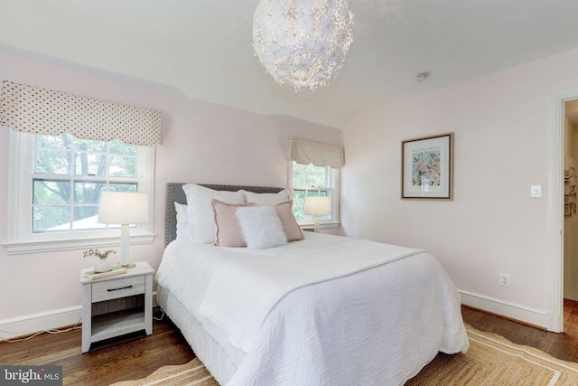 3703 Thornapple St, Chevy Chase, MD 20815 - bedroom featuring wood finished floors, baseboards, and a chandelier