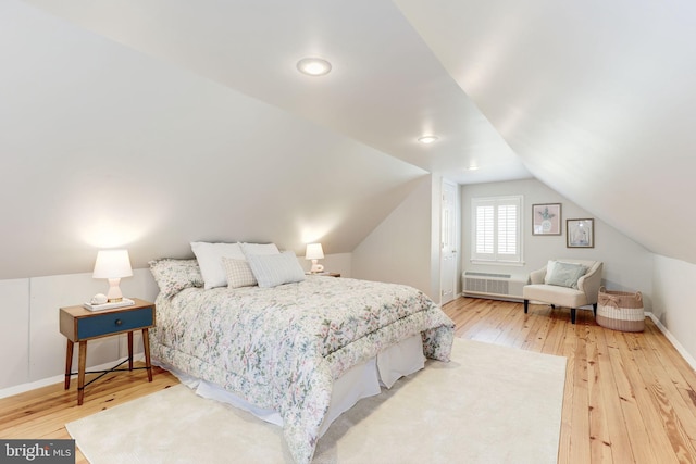 3703 Thornapple St, Chevy Chase, MD 20815 - bedroom with wood-type flooring, vaulted ceiling, baseboards, radiator heating unit, and recessed lighting